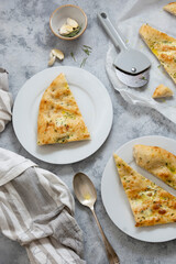 Slices of garlic foccacia bread. Freshly baked flat garlic bread with olive oil and herbs.