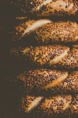 Bagel with sesame on black background	