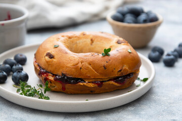 Bagels with blueberry and fruit jam, top view.