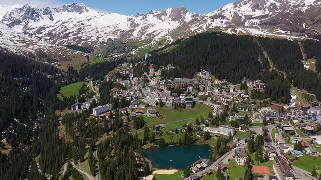 Aerial footage of the famous Arosa ski resort and village in Canton Graubunden in the alps in Switzerland in summer. Shot with a rotation motion