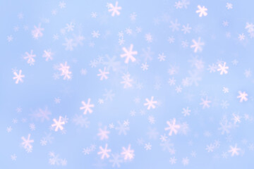 Abstract blue background with snowflake bokeh.Winter Christmas and New Year background.