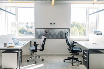 Empty office space while officer is working from home to avoid corona virus. Open space office in...