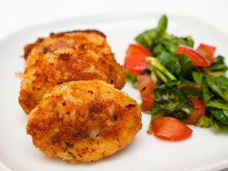 Pasteis de bacalhau - portuguese cod fritters with salad