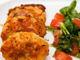 Pasteis de bacalhau - portuguese cod fritters with salad