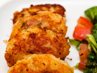 Pasteis de bacalhau - portuguese cod fritters with salad