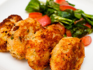 Pasteis de bacalhau - portuguese cod fritters with salad