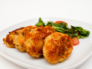 Pasteis de bacalhau - portuguese cod fritters with salad