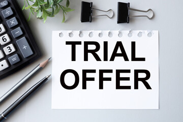 trial offer. text on white paper on gray background