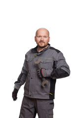 Obraz premium An aged 40 auto mechanic holding a repair wrench isolated on a white background