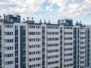 Fototapeta premium view of multi-apartment multi-storey residential building, panel monolithic new building, renovation, new residential areas in cities