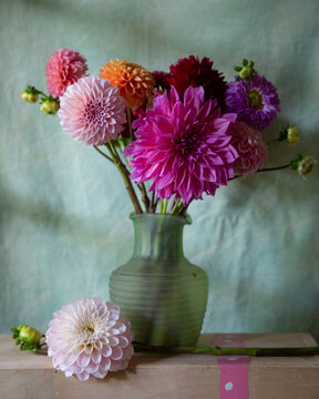 dahlias in green vintage vase