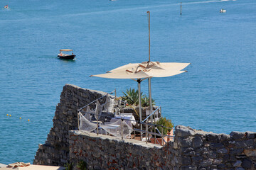 Fototapeta premium lustful terrace of a lounge bar overlooking the sea from a cliff