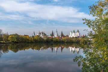 Izmailovo Kremlin and its reflection in a pond in early autumn. View from the side of Izmailovsky...