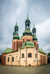 Fototapeta na wymiar View of Church of Saints Peter and Paul on Tumsky Island in rainy day: Poznan / Poland - September 28, 2020