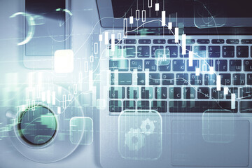 Stock market chart and top view computer on the table background. Multi exposure. Concept of financial analysis.