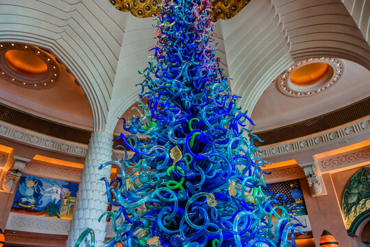 Chihuly sculpture in center of wonderful lounge in five stars Hotel Atlantis (1,539 spacious guest rooms including 166 suites) on man-made island of Palm Jumeirah. DUBAI, UAE. September 7, 2015.