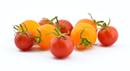 Red and yellow cherry tomatoes isolated on a white background. Healthy vegetarian food concept.