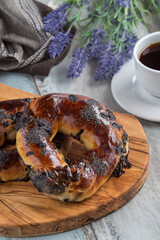 Turkish bagel acma with chocolate and tea on wooden background.