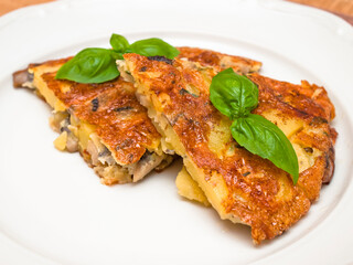 Spanish tortilla with mushrooms and basil