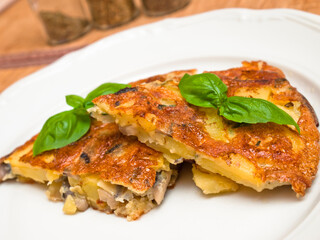 Spanish tortilla with mushrooms and basil