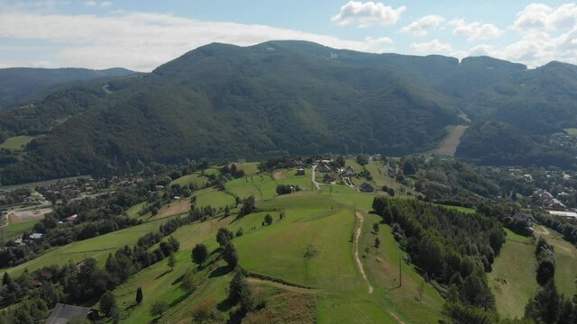 Flying over Beskid Sadecki Mountains in summer near village Rytro and Polom mountain, Poland. View of Makowica and Jaworzyna Range.