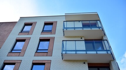 Futuristic square architecture of apartment building for real estate with big windows.