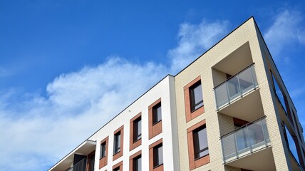Futuristic square architecture of apartment building for real estate with big windows.