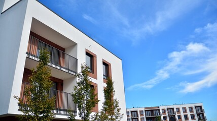 Futuristic square architecture of apartment building for real estate with big windows.