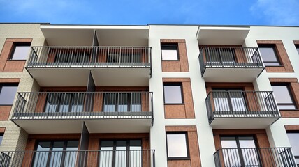 Futuristic square architecture of apartment building for real estate with big windows.