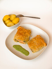 Salmon in puff pastry with potatoes