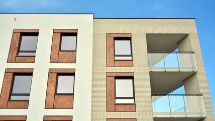 Obraz premium Futuristic square architecture of apartment building for real estate with big windows.