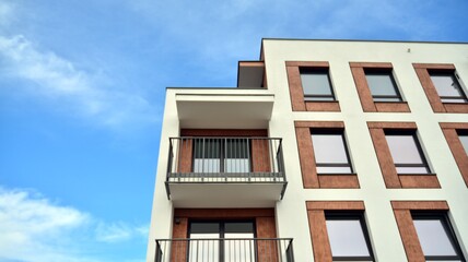 Futuristic square architecture of apartment building for real estate with big windows.