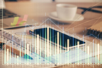 Double exposure of forex chart drawing and cell phone background. Concept of financial data analysis