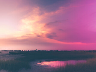 Fototapeta na wymiar Vintage Style Cloudscape over the Marshland Pond at Twilight on Cape Cod