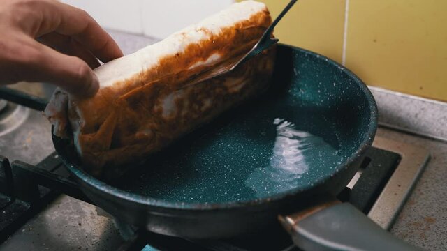 Cooking Meat Shawarma in a Hot Pan Until Crisp. Fry Pita Bread in Kitchen.