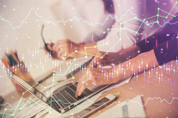 Multi exposure of woman hands typing on computer and financial chart hologram drawing. Stock market analysis concept.