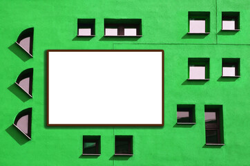 Green background with Windows and a white frame for your text. Facade with many small atypical windows on the facade of green color.