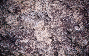 Vignetting of the structure of the surface of the Stone. The idea for texture background. Natural rocks closeup shot.