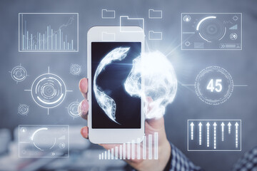 Double exposure of man's hands holding and using a digital device and forex graph drawing. Financial market concept.