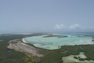 Fototapeta na wymiar Landscape Caribbean island with shore coast of various shades of blue. National Marine Sanctuary in Los Roques, National Park