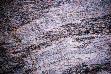 Vignetting of the structure of the surface of the Stone. The idea for texture background. Natural rocks closeup shot.