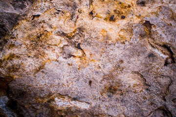 Vignetting of the structure of the surface of the Stone. The idea for texture background. Natural rocks closeup shot.