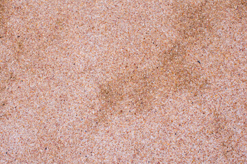 Natural color sand wash surface floor made of small sand stone. Image for background texture.