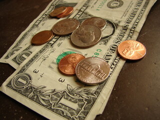 American cash money - bills and coins - close up