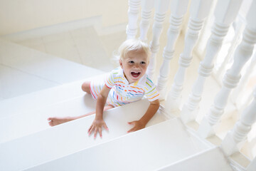 Kids on stairs. Child moving into new home.