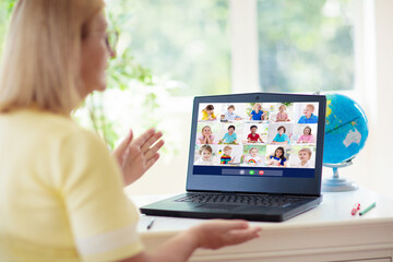 Online remote learning. Teacher with computer.