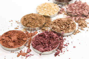 Colorful crushed Eyeshadow on a White background