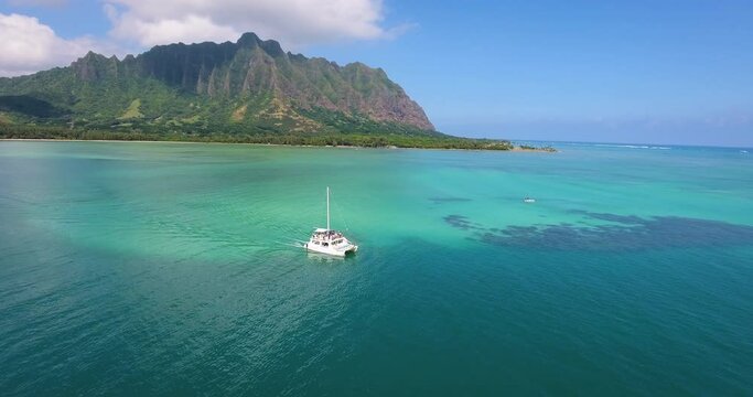 Boat off Hawaiian coast, wide aerial
