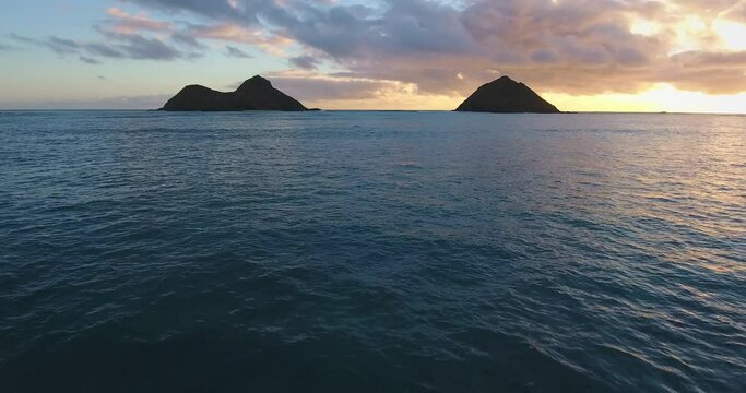 Pair of islands at sunset in Hawaii, wide aerial