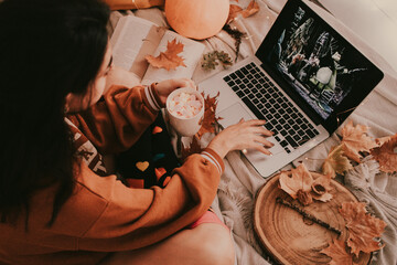 Enjoying Halloween in bed, with a good hot cup and sweets and the laptop at home